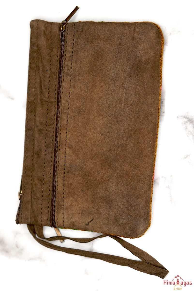 A stylish yet convenient hand woven wristlet purse with beautiful floral pattern, It has a secure zip top closure and two extra compartments for your everyday essentials making it easy to travel simple and light.