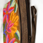 A stylish yet convenient hand woven wristlet purse with beautiful floral pattern, It has a secure zip top closure and two extra compartments for your everyday essentials making it easy to travel simple and light.