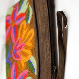 A stylish yet convenient hand woven wristlet purse with beautiful floral pattern, It has a secure zip top closure and two extra compartments for your everyday essentials making it easy to travel simple and light.