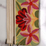 A stylish yet convenient hand woven wristlet purse with beautiful floral pattern, It has a secure zip top closure and two extra compartments for your everyday essentials making it easy to travel simple and light.
