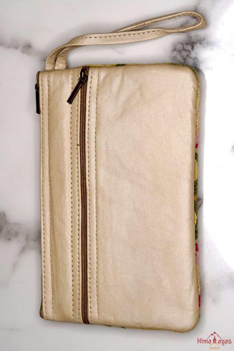 A stylish yet convenient hand woven wristlet purse with beautiful floral pattern, It has a secure zip top closure and two extra compartments for your everyday essentials making it easy to travel simple and light.
