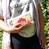 A stylish yet convenient hand woven wristlet purse with beautiful floral pattern, It has a secure zip top closure and two extra compartments for your everyday essentials making it easy to travel simple and light.