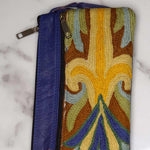 A stylish and ethically made wristlet purse to carry all your everyday essentials.