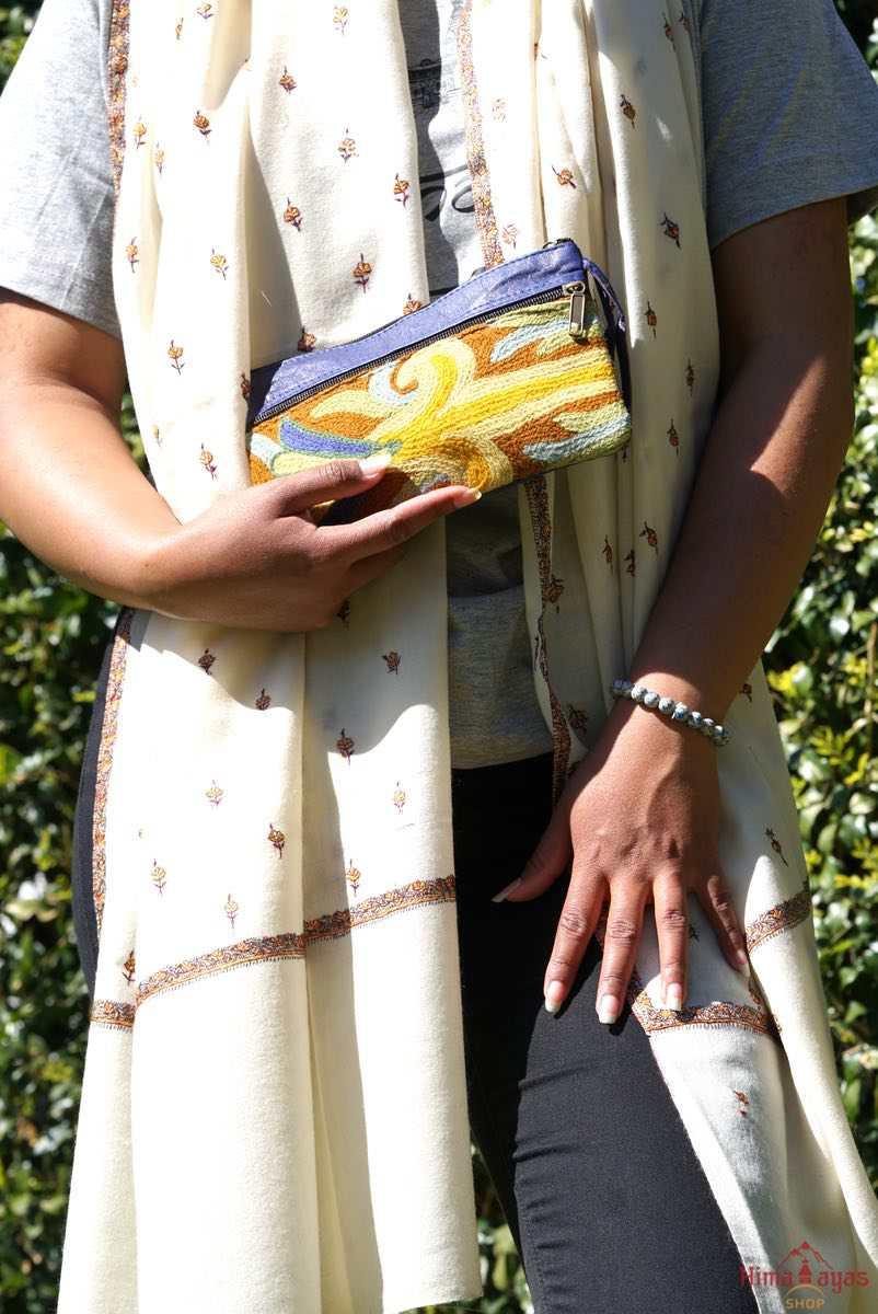 A stylish and ethically made wristlet purse to carry all your everyday essentials.