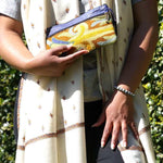 A stylish and ethically made wristlet purse to carry all your everyday essentials.