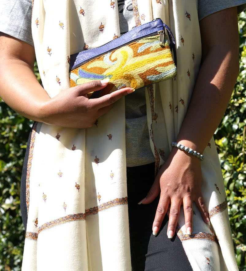 A stylish and ethically made wristlet purse to carry all your everyday essentials.