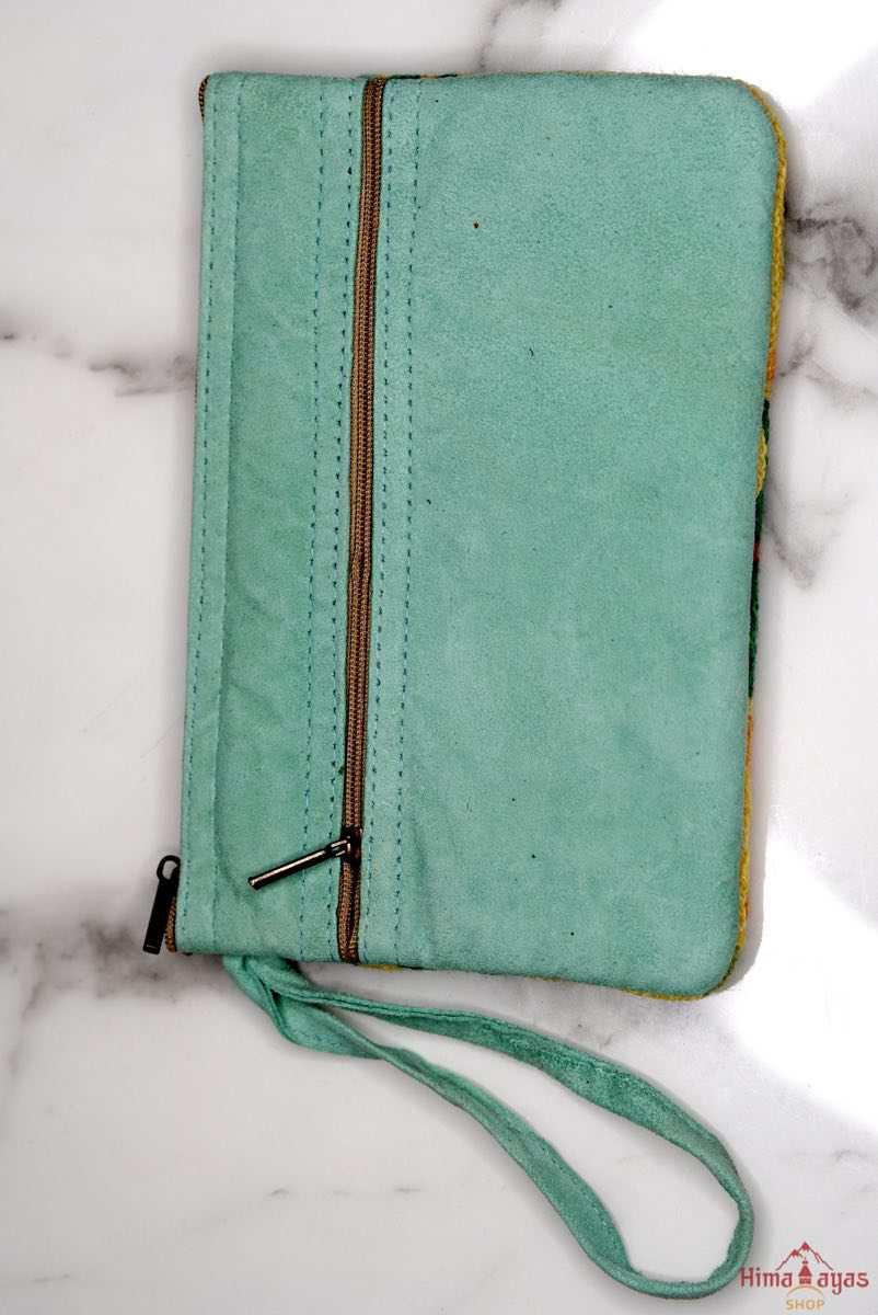 A stylish yet convenient hand woven wristlet purse with beautiful floral pattern, It has a secure zip top closure and two extra compartments for your everyday essentials making it easy to travel simple and light.