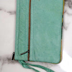 A stylish yet convenient hand woven wristlet purse with beautiful floral pattern, It has a secure zip top closure and two extra compartments for your everyday essentials making it easy to travel simple and light.