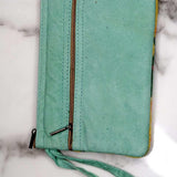 A stylish yet convenient hand woven wristlet purse with beautiful floral pattern, It has a secure zip top closure and two extra compartments for your everyday essentials making it easy to travel simple and light.