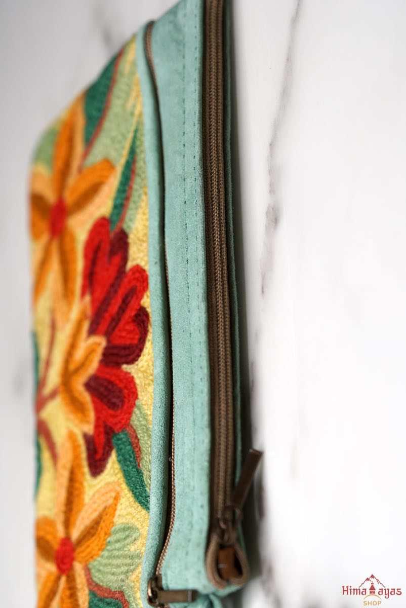 A stylish yet convenient hand woven wristlet purse with beautiful floral pattern, It has a secure zip top closure and two extra compartments for your everyday essentials making it easy to travel simple and light.