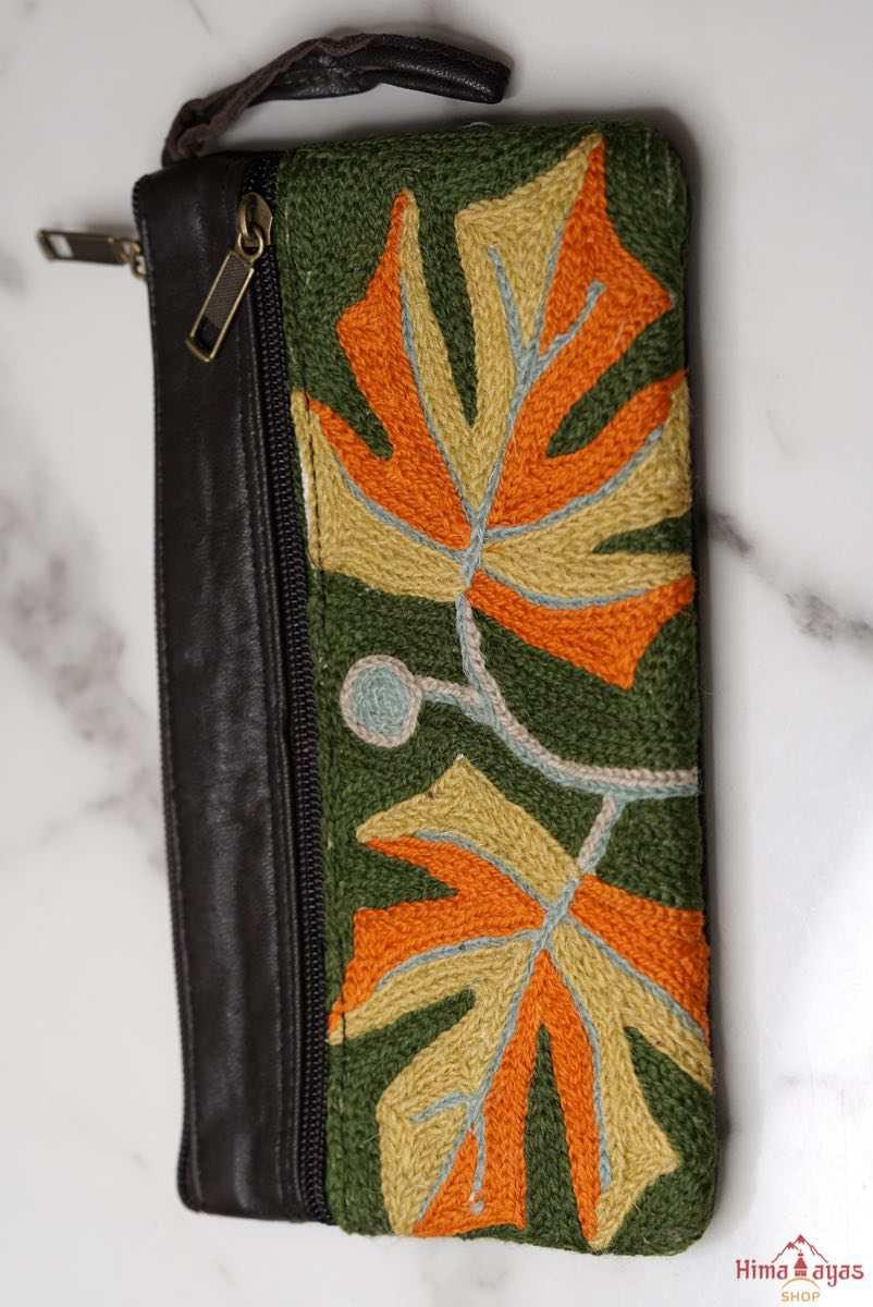 A beautifully hand-embroidered purse with a wristlet and a secure zip top closure. Perfect gift for your loved ones!