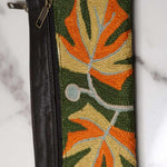 A beautifully hand-embroidered purse with a wristlet and a secure zip top closure. Perfect gift for your loved ones!