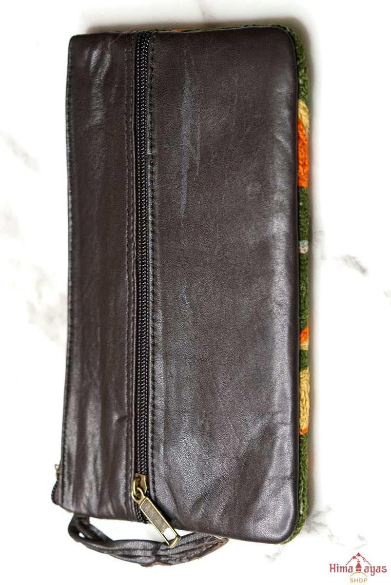 A beautifully hand-embroidered purse with a wristlet and a secure zip top closure. Perfect gift for your loved ones!