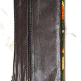 A beautifully hand-embroidered purse with a wristlet and a secure zip top closure. Perfect gift for your loved ones!