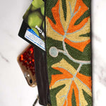 A beautifully hand-embroidered purse with a wristlet and a secure zip top closure. Perfect gift for your loved ones!