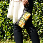 A beautifully hand-embroidered purse with a wristlet and a secure zip top closure. Perfect gift for your loved ones!