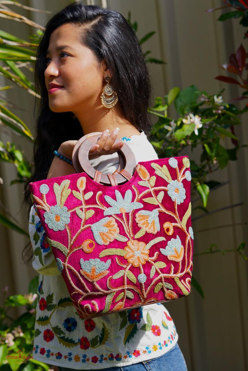 A classic women's tote bag, crafted with beautiful cashmere floral embroidery to give it a chic stylish look.