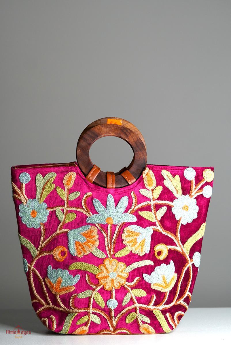 A classic women's tote bag, crafted with beautiful cashmere floral embroidery to give it a chic stylish look.