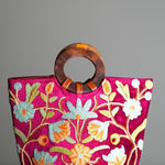 A classic women's tote bag, crafted with beautiful cashmere floral embroidery to give it a chic stylish look.