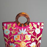 A classic women's tote bag, crafted with beautiful cashmere floral embroidery to give it a chic stylish look.