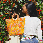 A stylish women's tote bag with floral pattern, crafted ethically from Himalayas.