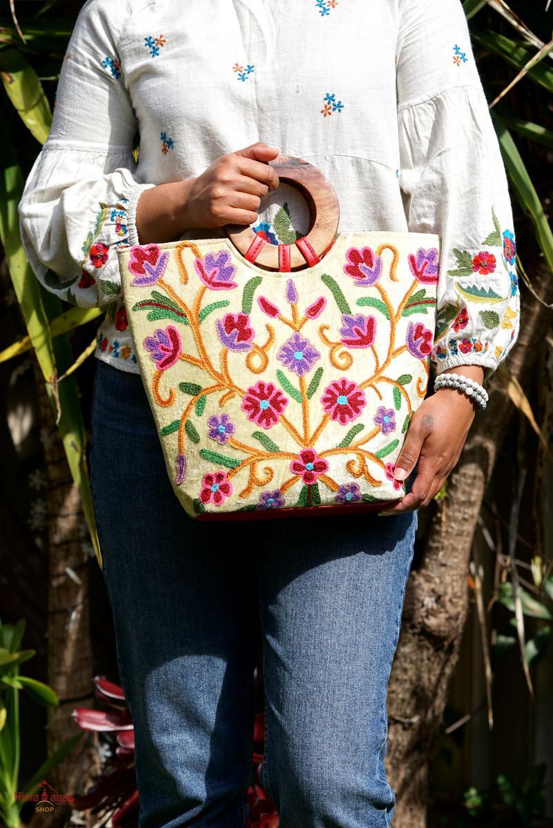 A stylish women's tote bag with floral pattern, crafted ethically from Himalayas.