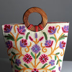 A stylish women's tote bag with floral pattern, crafted ethically from Himalayas.