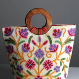 A stylish women's tote bag with floral pattern, crafted ethically from Himalayas.