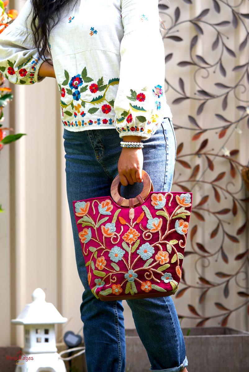 Beautiful hand embroidered tote bag with bright and multi-colour embroidered floral patterns.