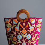 Beautiful hand embroidered tote bag with bright and multi-colour embroidered floral patterns.