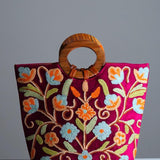 Beautiful hand embroidered tote bag with bright and multi-colour embroidered floral patterns.