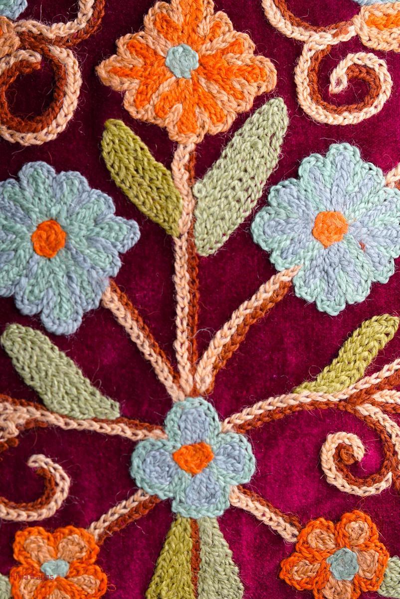 Beautiful hand embroidered tote bag with bright and multi-colour embroidered floral patterns.