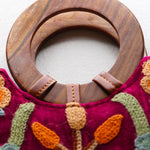 Beautiful hand embroidered tote bag with bright and multi-colour embroidered floral patterns.