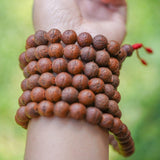 Antique Dark Bodhi Bead Mala being worn around