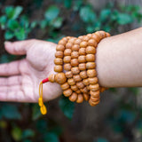 Natural Bodhi Bead Wrist Mala being worn