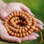 Natural Bodhi Bead Wrist Mala being held