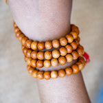 108 Beads Sandalwood Mala in wrist