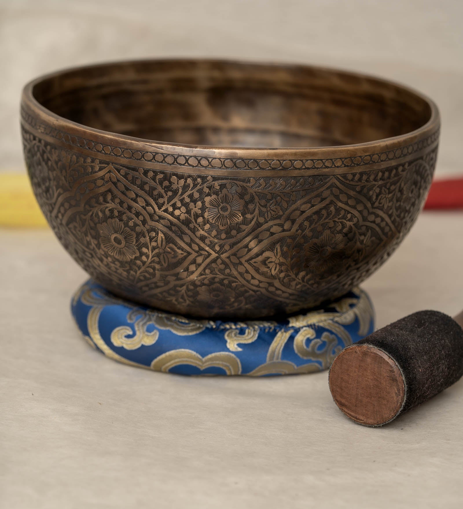 Handmade Himalayan lotus singing bowl carved design tuned to F3 and C5 for throat chakra sound healing