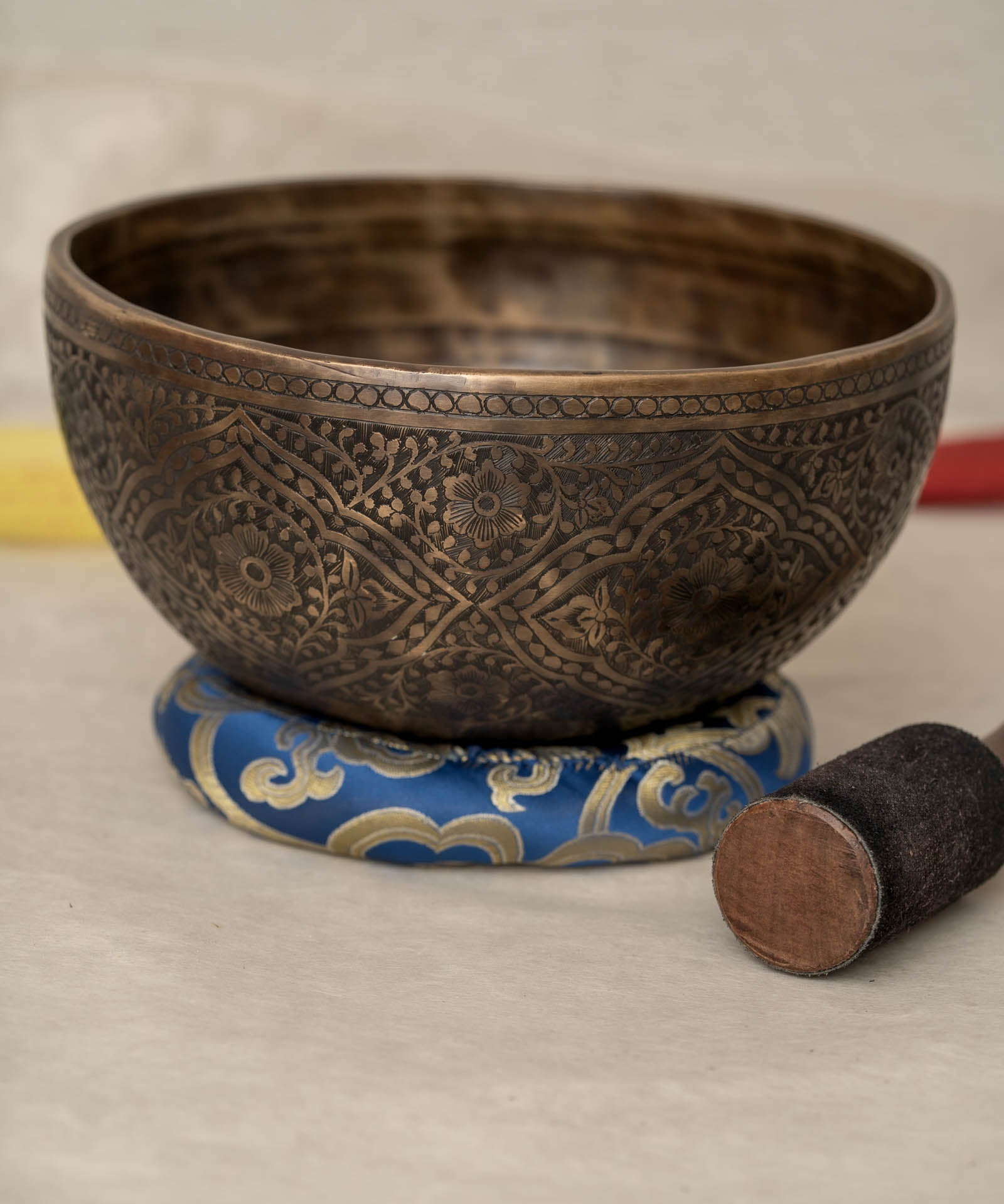 Handmade Himalayan lotus singing bowl carved design tuned to F3 and C5 for throat chakra sound healing