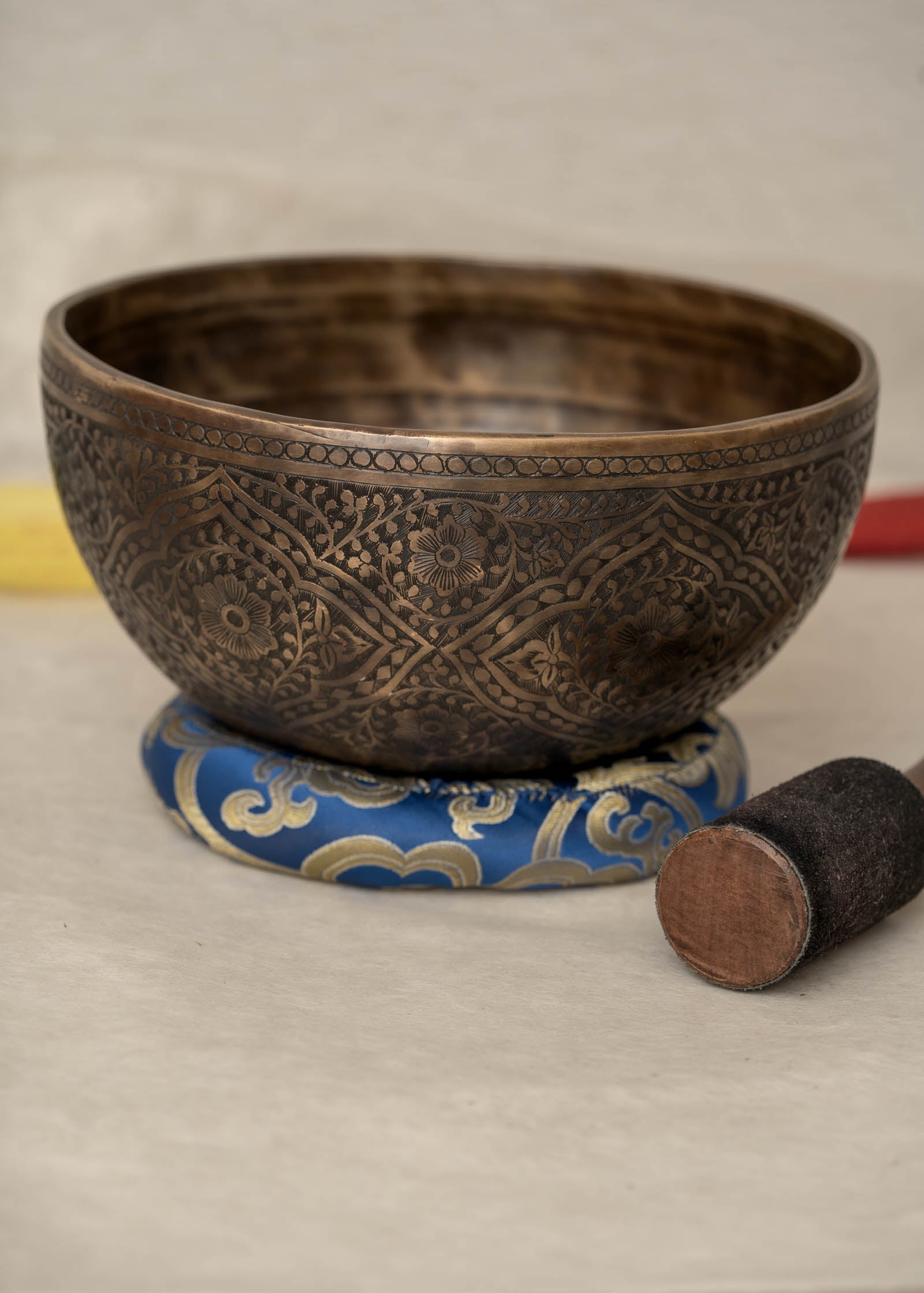 Handmade Himalayan lotus singing bowl carved design tuned to F3 and C5 for throat chakra sound healing