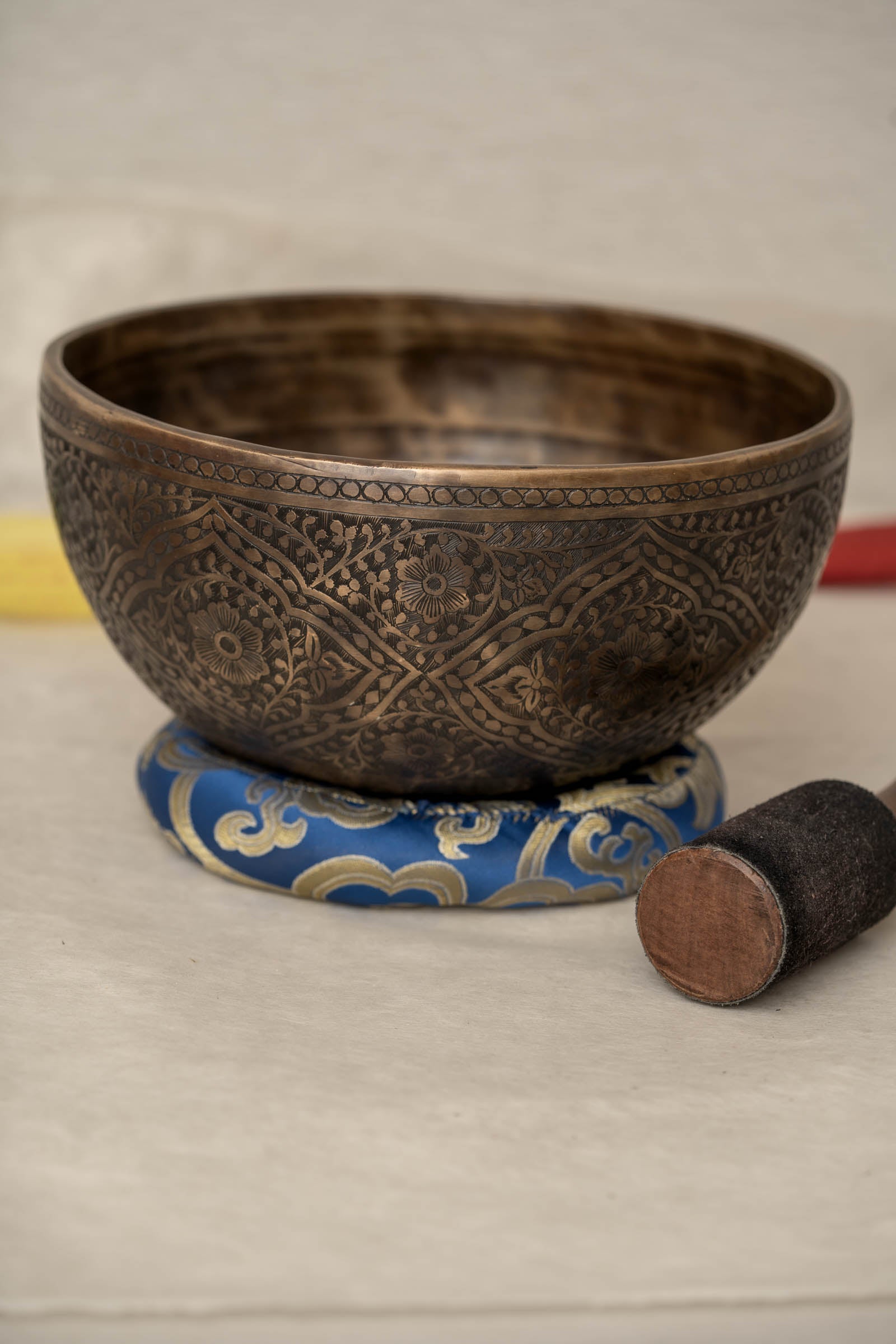 Handmade Himalayan lotus singing bowl carved design tuned to F3 and C5 for throat chakra sound healing