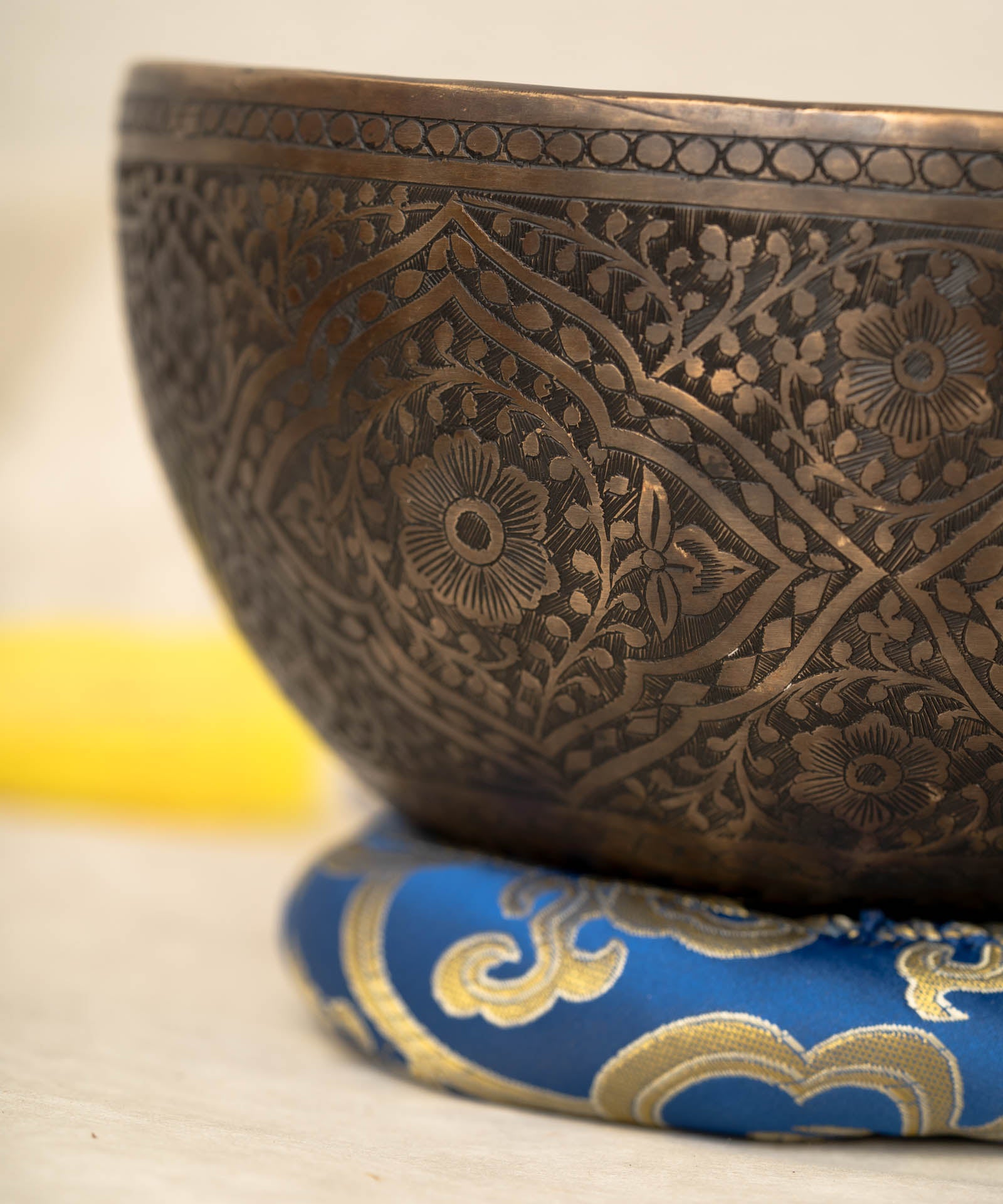 Handmade Himalayan lotus singing bowl carved design tuned to F3 and C5 for throat chakra sound healing