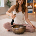 Women is playing a singing bowl 