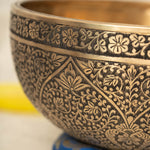 Lotus Floral Engraved handmade Tibetan singing bowl with brass carving, wooden mallet, and cushion for meditation and chakra healing