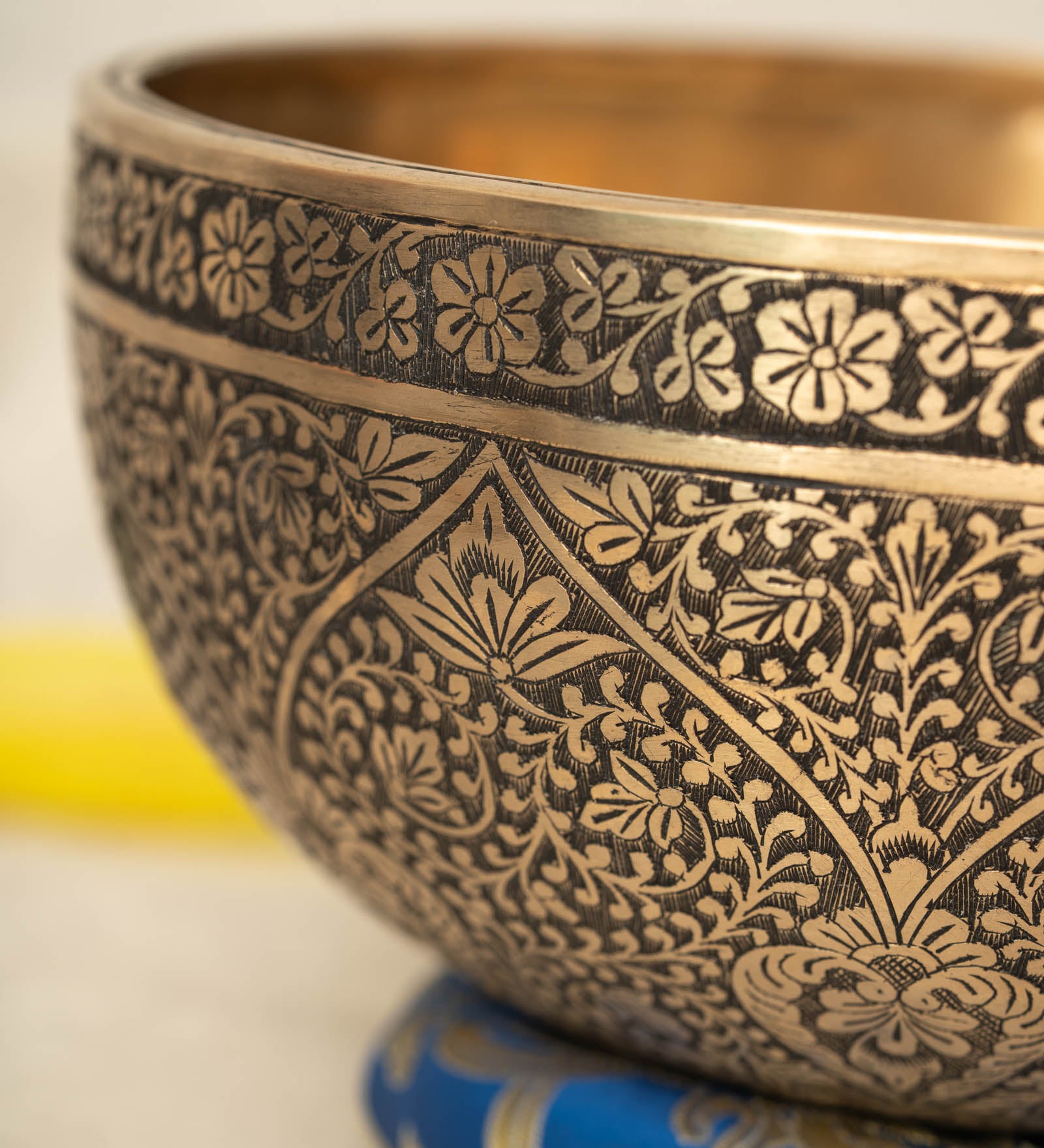 Lotus Floral Engraved handmade Tibetan singing bowl with brass carving, wooden mallet, and cushion for meditation and chakra healing