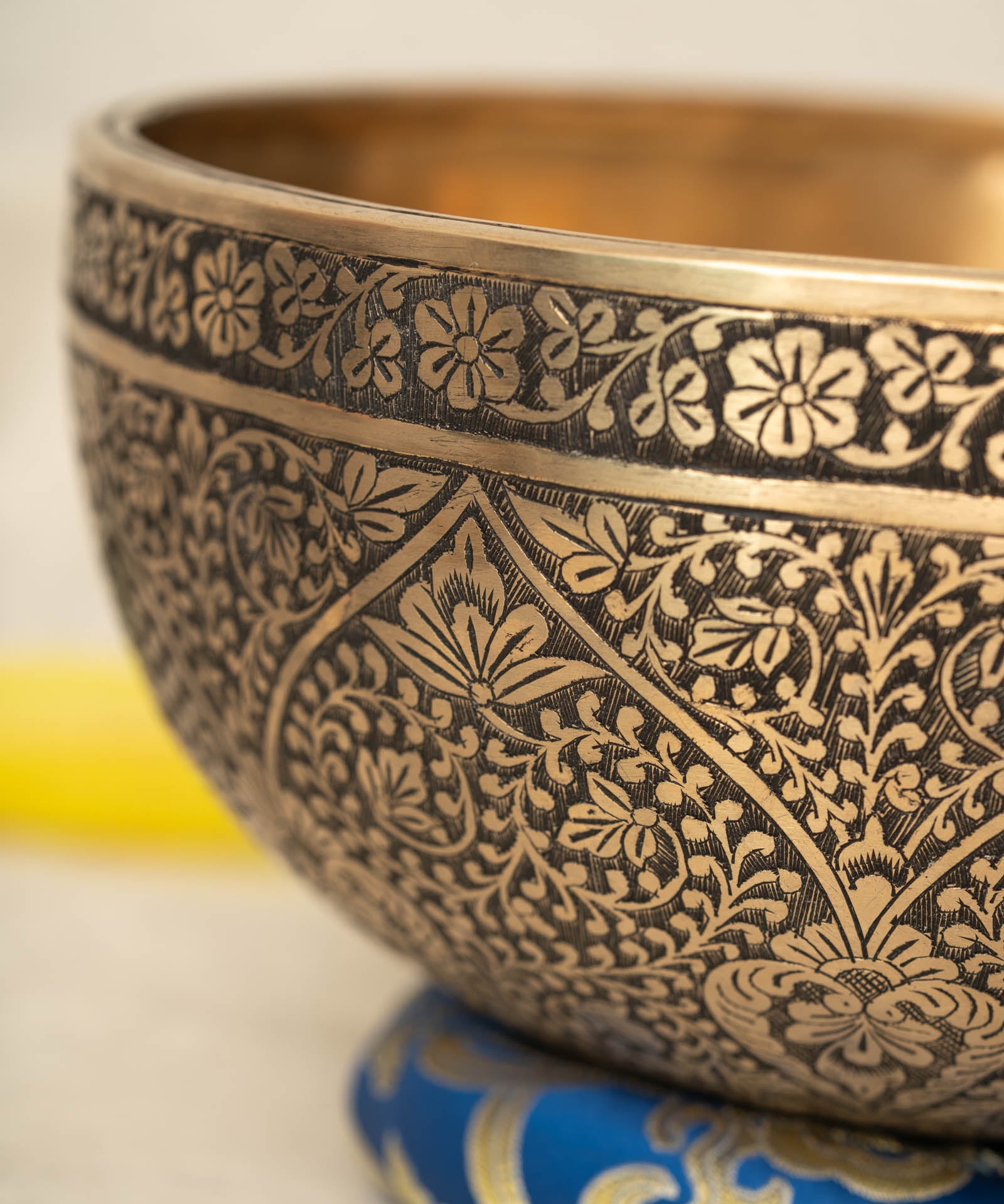 Lotus Floral Engraved handmade Tibetan singing bowl with brass carving, wooden mallet, and cushion for meditation and chakra healing