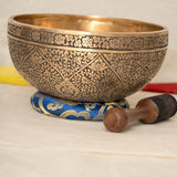 Lotus Floral Engraved handmade Tibetan singing bowl with brass carving, wooden mallet, and cushion for meditation and chakra healing