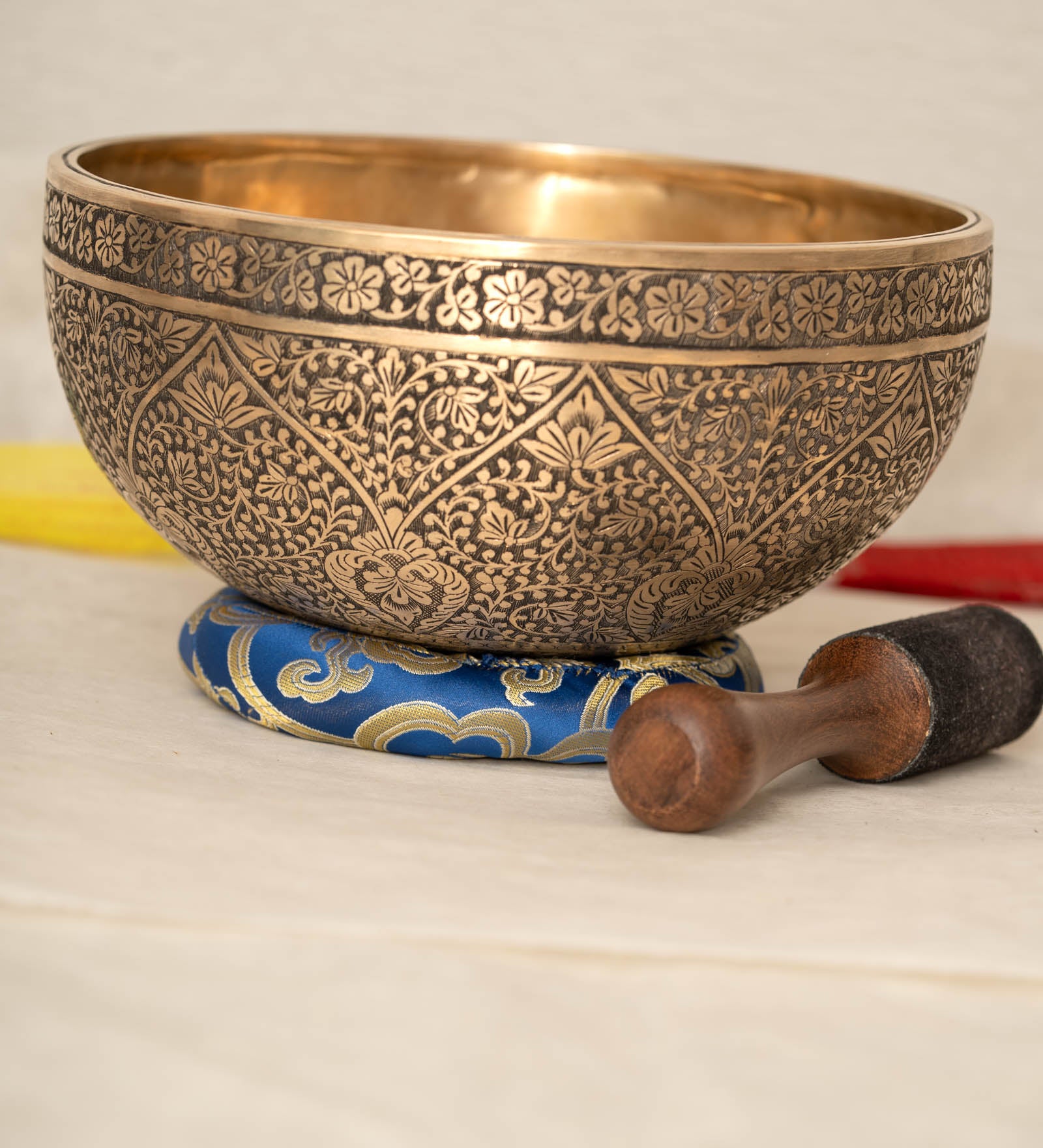 Lotus Floral Engraved handmade Tibetan singing bowl with brass carving, wooden mallet, and cushion for meditation and chakra healing