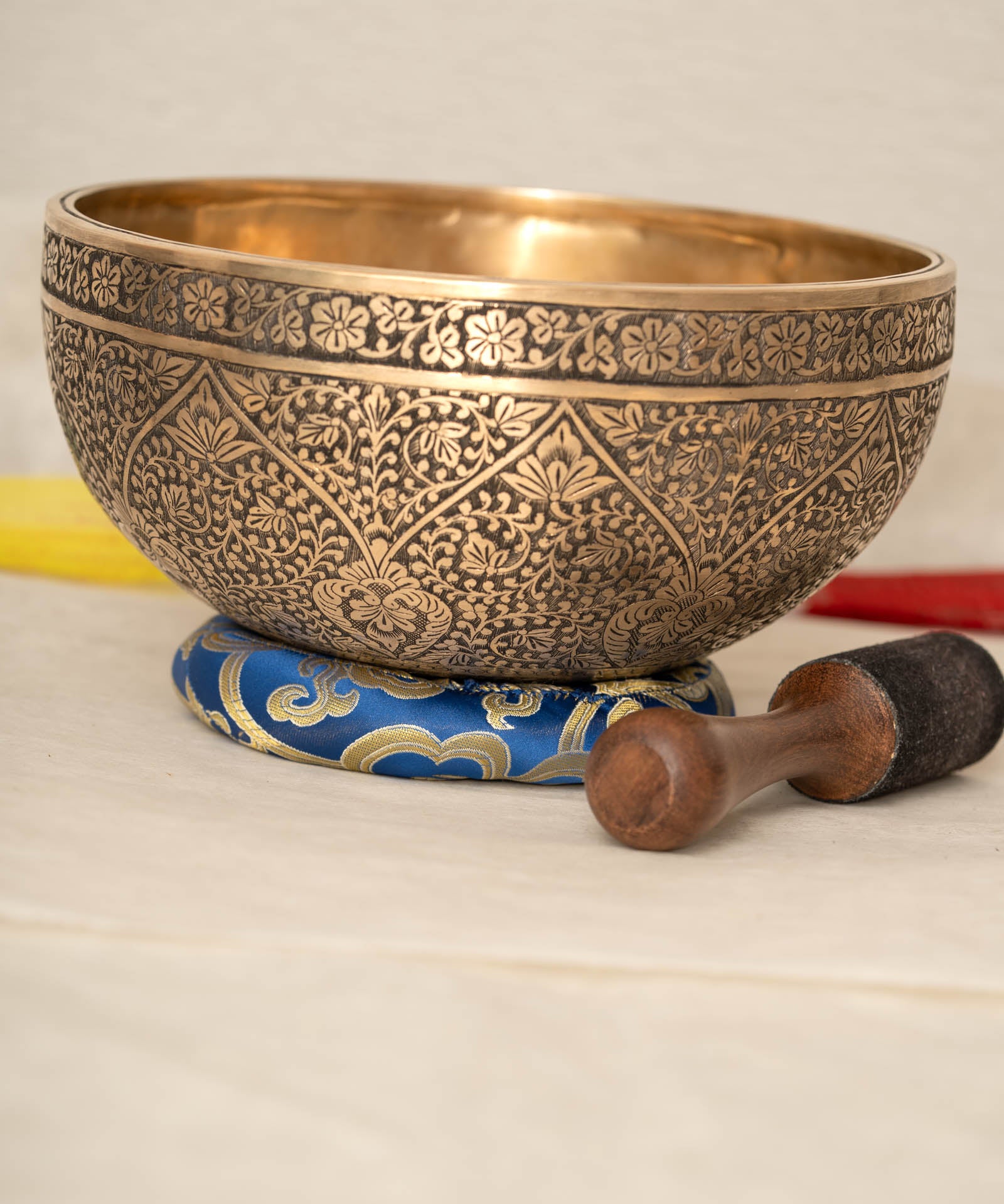 Lotus Floral Engraved handmade Tibetan singing bowl with brass carving, wooden mallet, and cushion for meditation and chakra healing