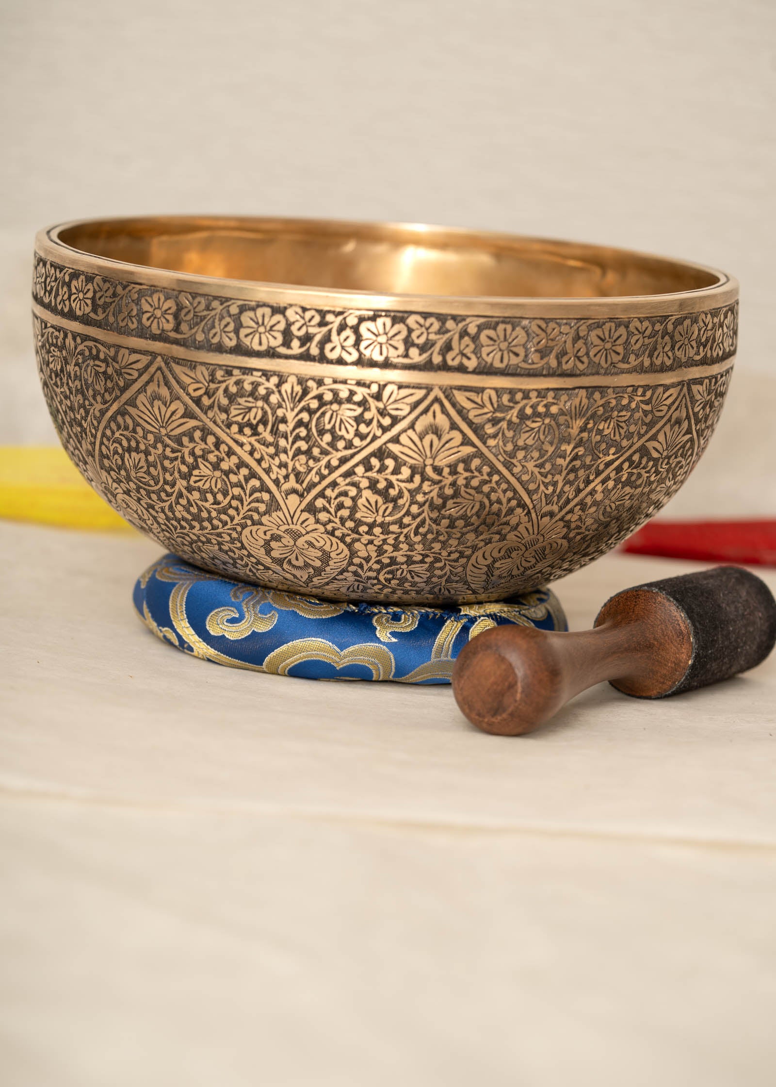 Lotus Floral Engraved handmade Tibetan singing bowl with brass carving, wooden mallet, and cushion for meditation and chakra healing